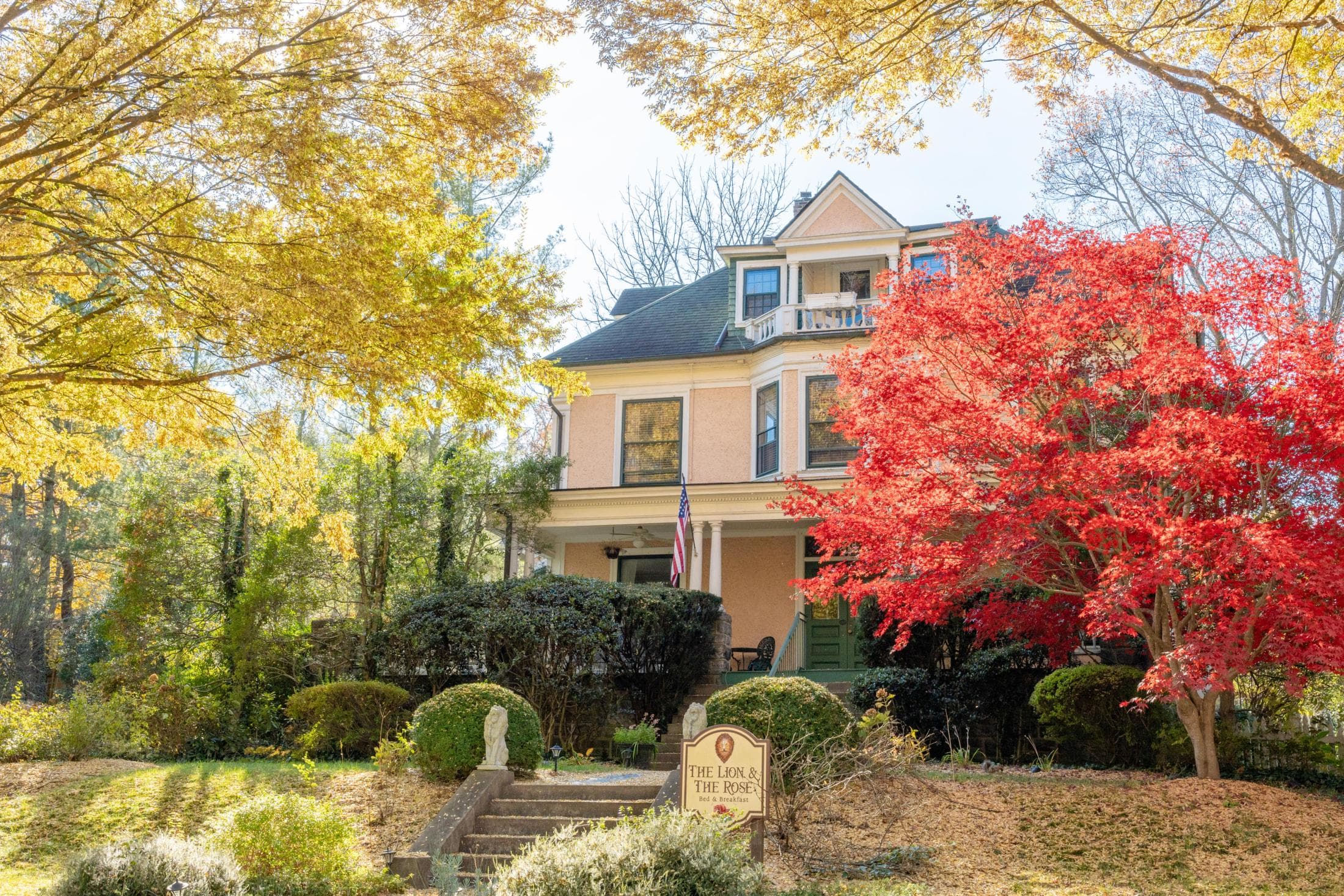 Beaufort House B&B in Asheville, a yellow house surrounded by red and yellow-leafed trees Beaufort House B&B in Asheville, a yellow house surrounded by red and yellow-leafed trees