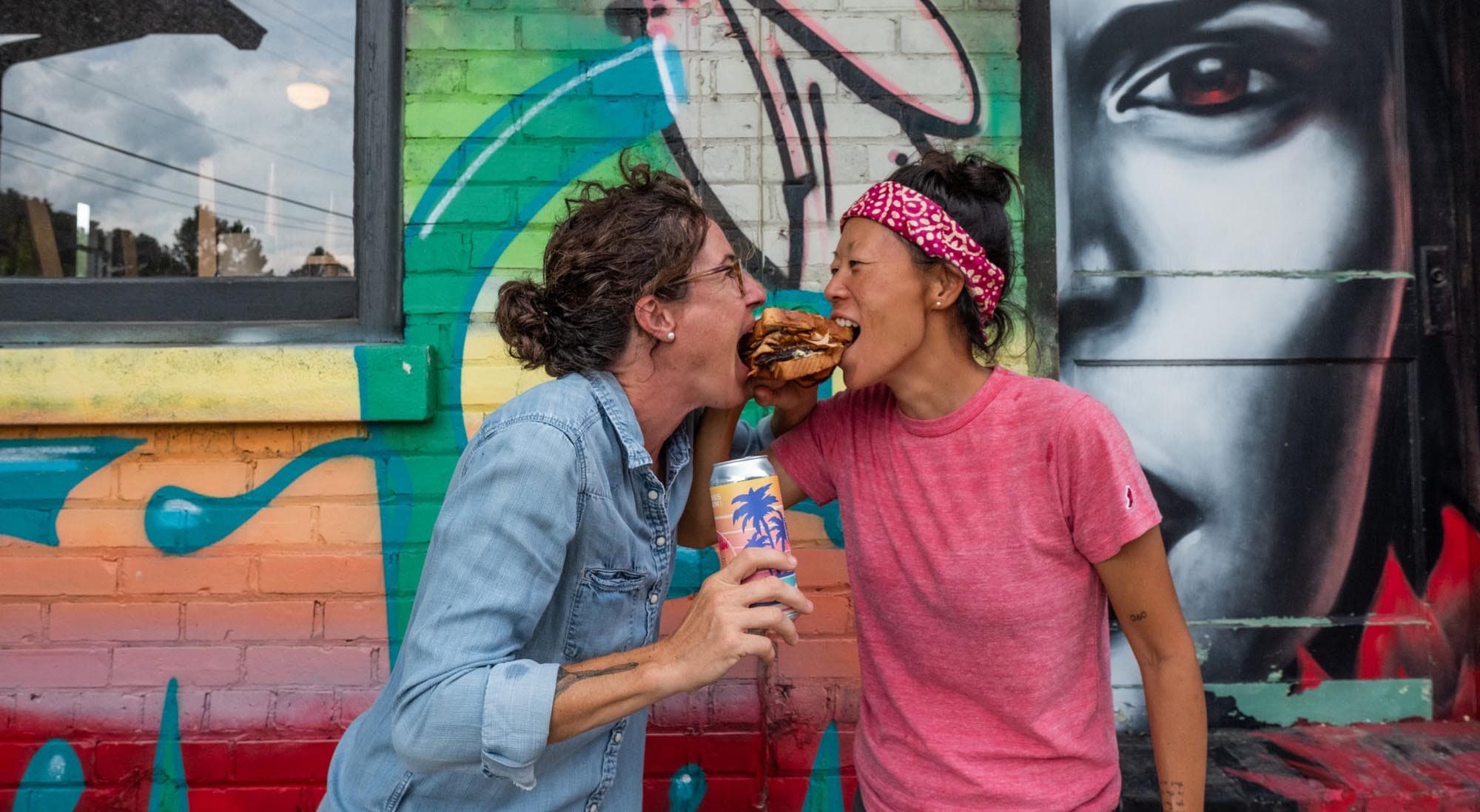 Dining in the River Arts District Couple sharing a burger