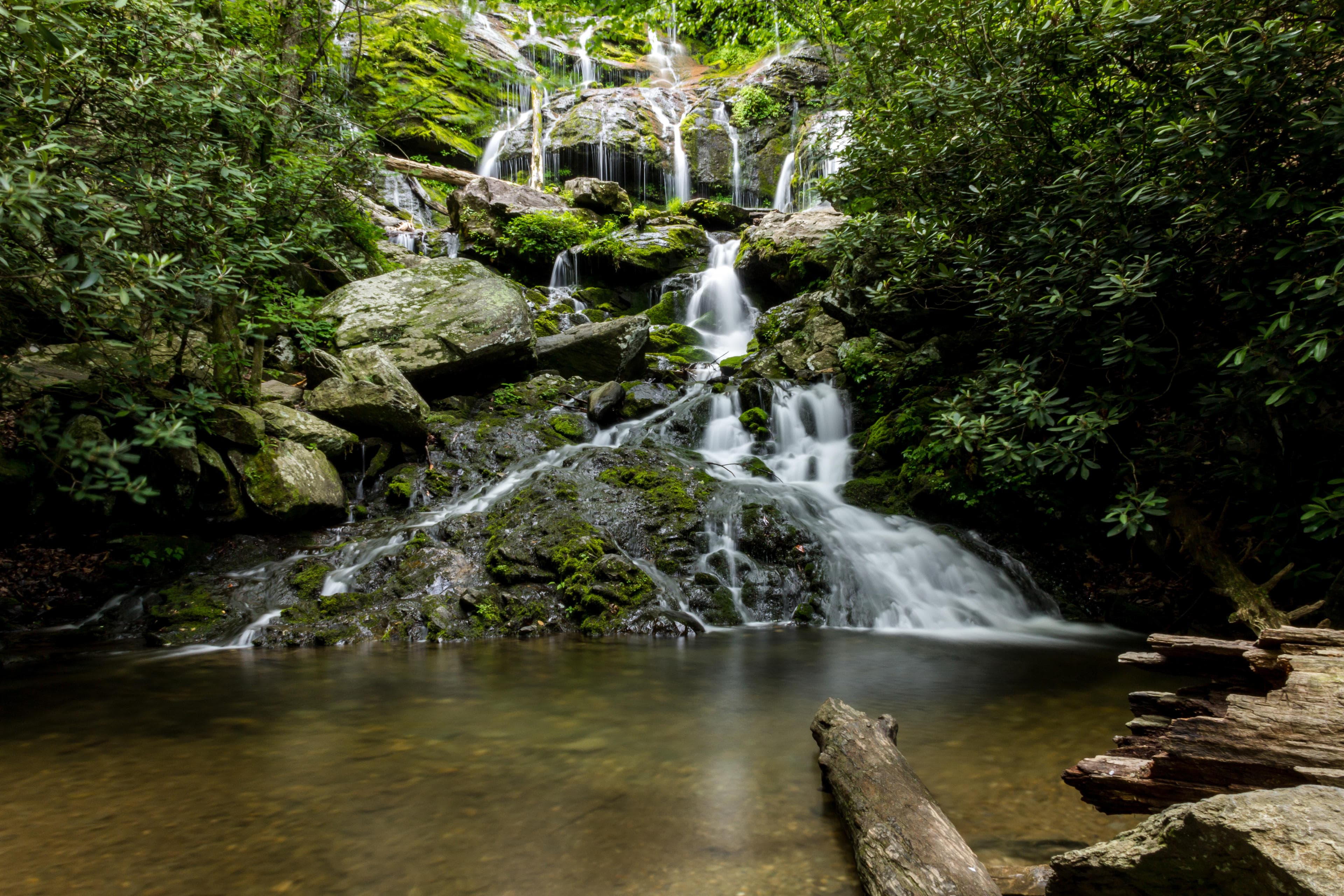 The cascade of Catawba Falls flows into a pond in Asheville The cascade of Catawba Falls flows into a pond in Asheville