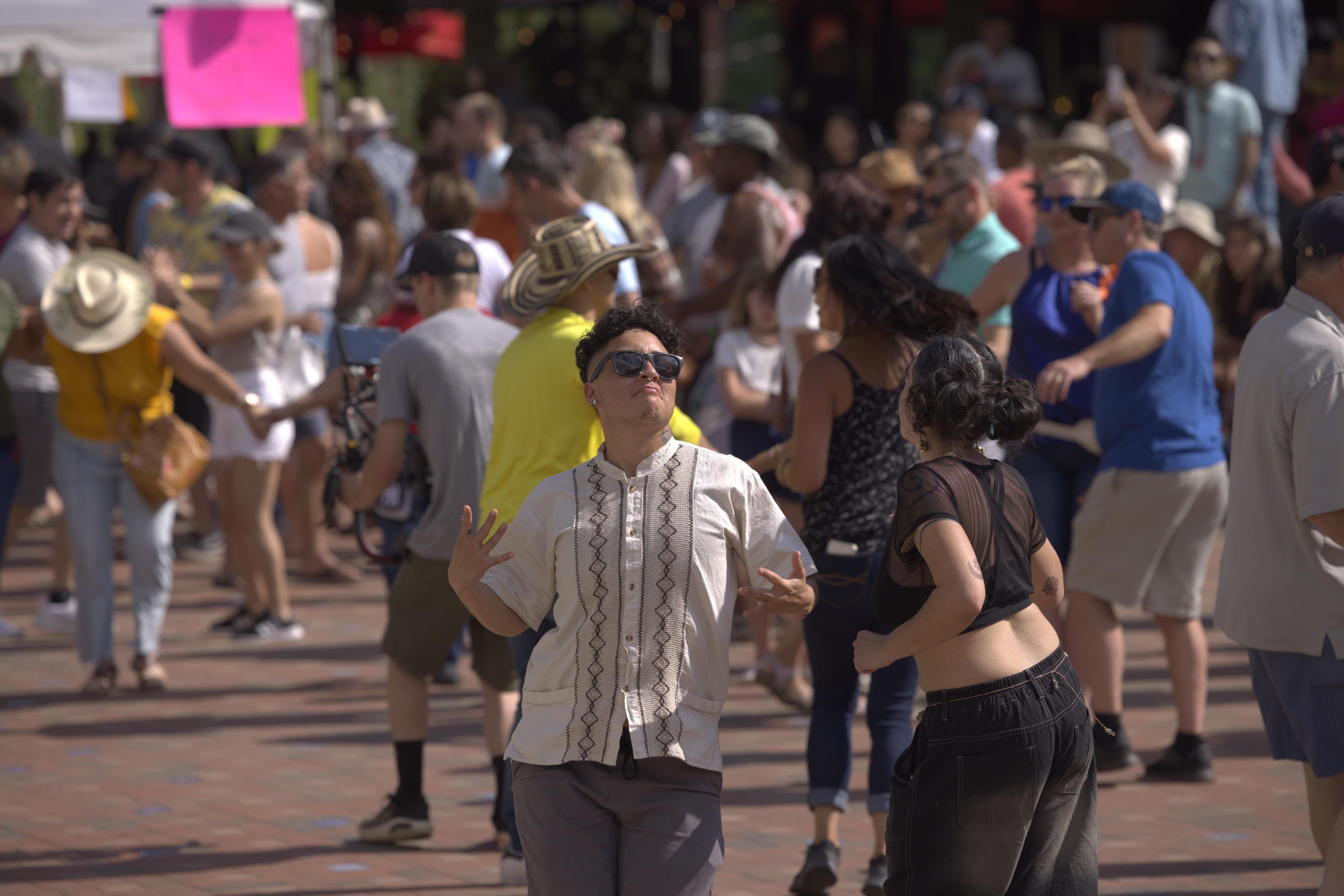 Celebrating a Generation of Asheville's Latinx Community Two people dance at a festival in Asheville