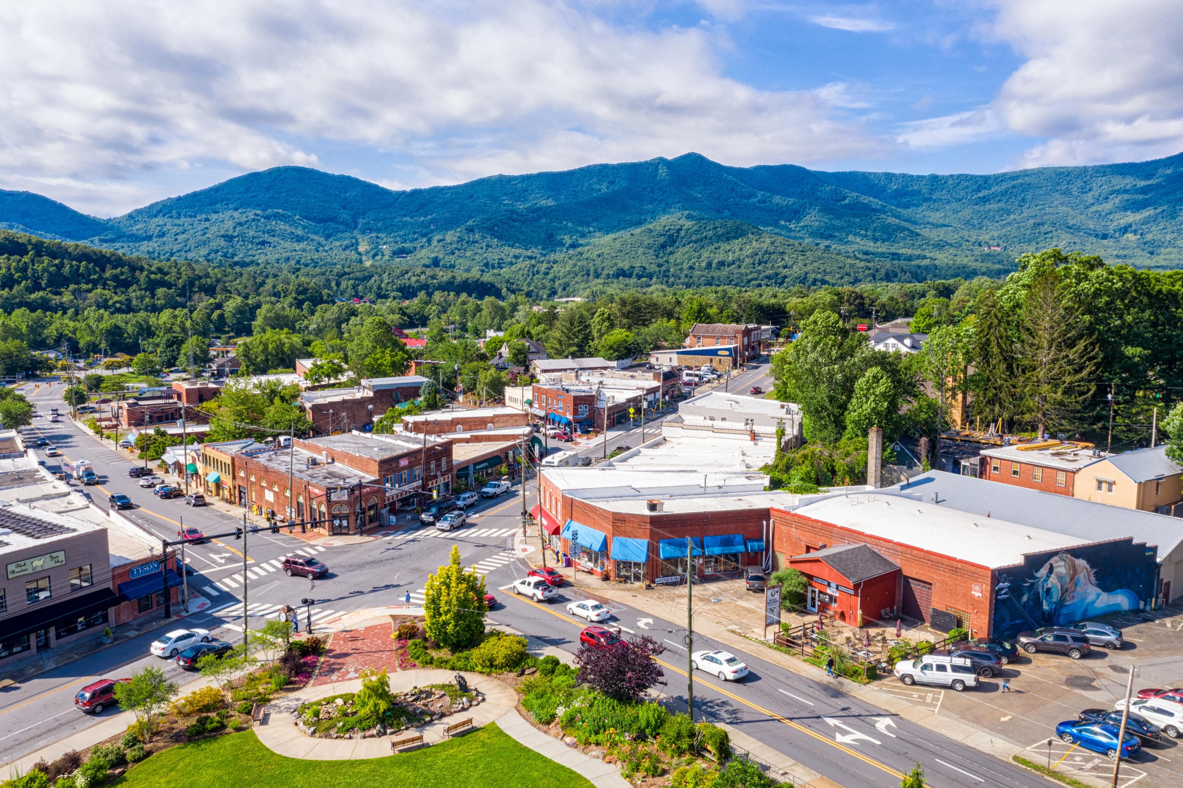 The Top 10 Things to Do in Black Mountain, NC an aerial view of a Black Mountain neighborhood with mountains in the background