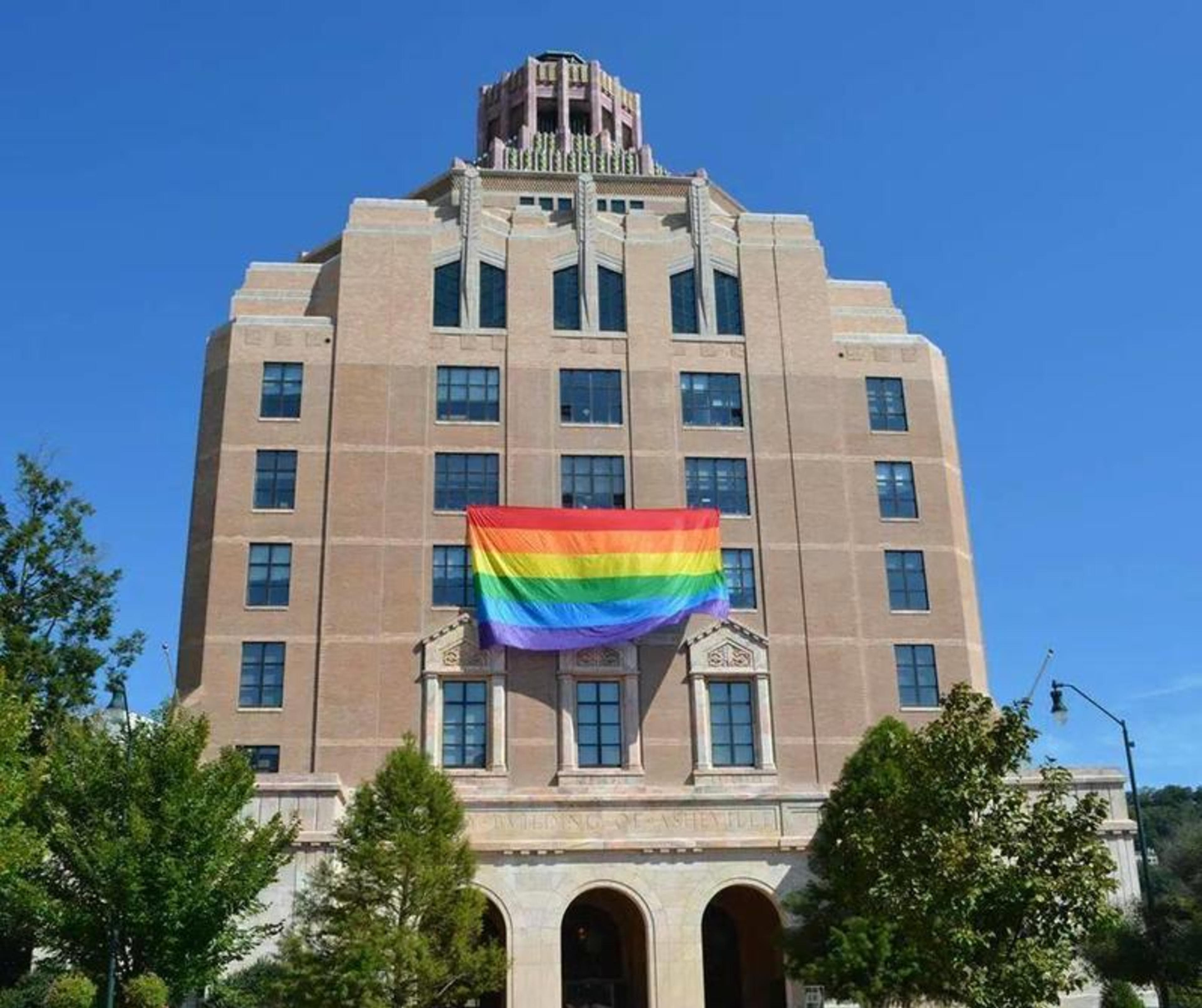 LGBTQ+ Resource Guide for Asheville A building in Asheville has a pride flag on the front