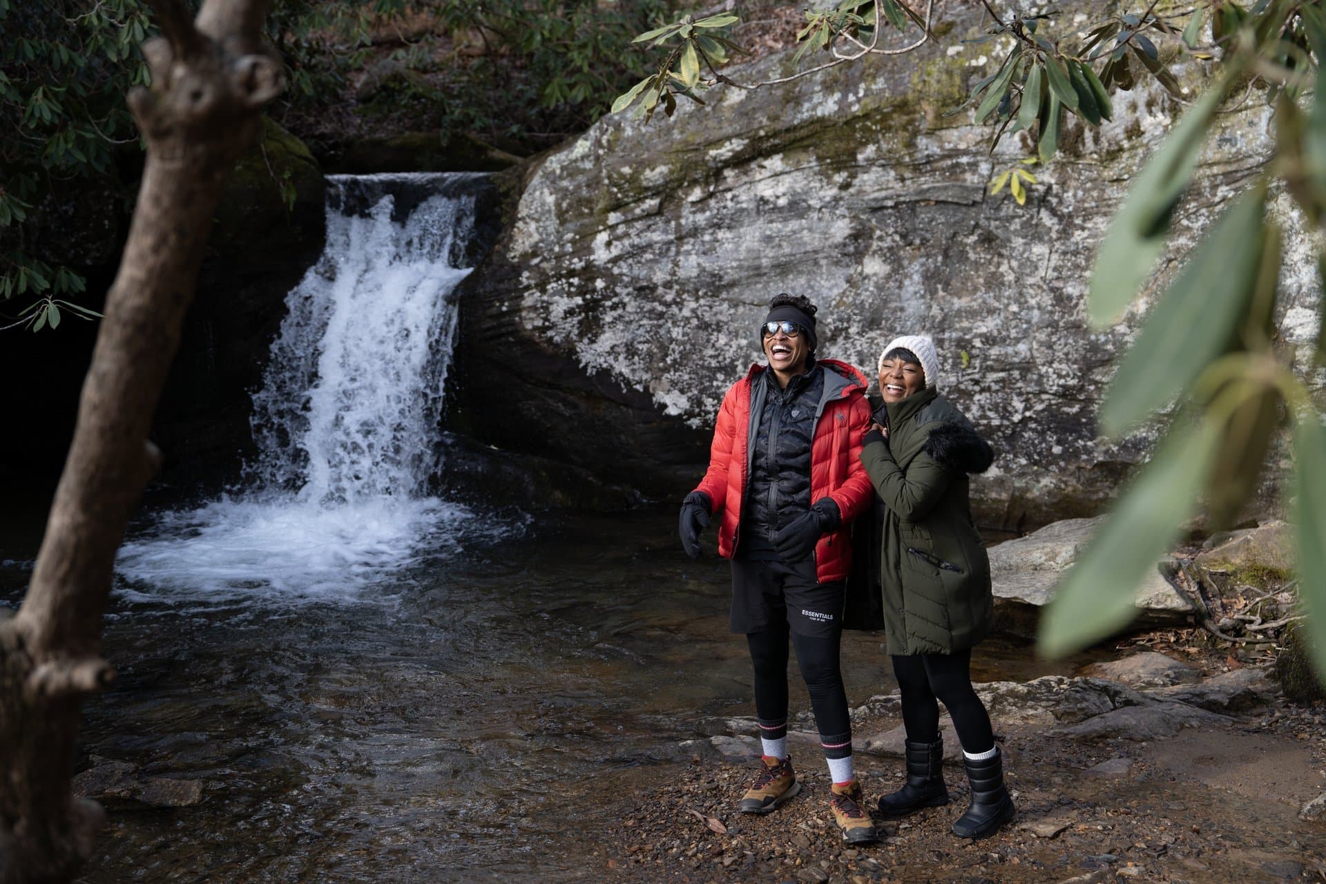 The Best Waterfalls Near Asheville, NC Couple at Waterfall