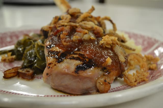 This delightful pork chop is one of several entrees on our nightly dinner menu. Try this topped with homemade bacon, homemade apple butter and crispy shallots. This delightful pork chop is one of several entrees on our nightly dinner menu. Try this topped with homemade bacon, homemade apple butter and crispy shallots.